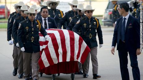 An honor guard escorts the casket of Harris County Sheriff&#39;s Deputy Sandeep Dhaliwal for his funeral at Berry Center on Wednesday, Oct. 2, 2019, in Cypress, Texas. Dhaliwal was killed in the line of duty Friday, when he was shot and killed during a traffic stop. (Brett Coomer/Houston Chronicle via AP)
