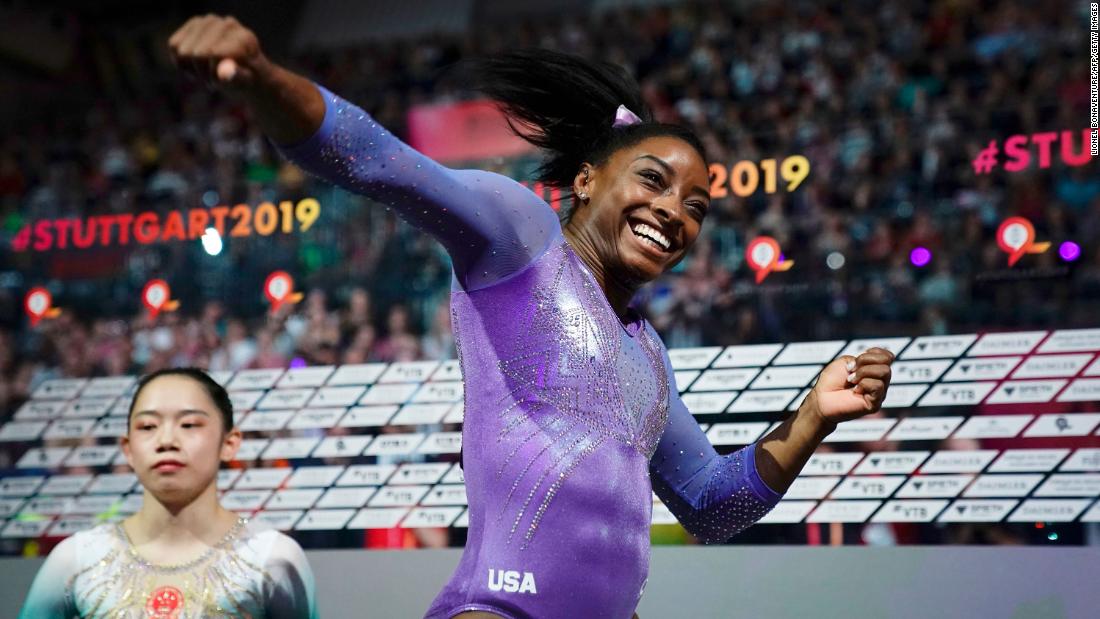 Biles celebrates after winning the beam apparatus final at the 2019 World Championships.