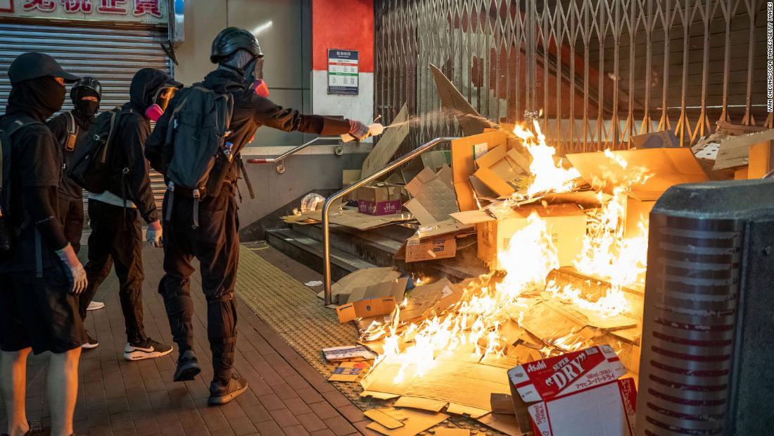 Protesters start a fire in front of the MTR station during demonstration on October 27.