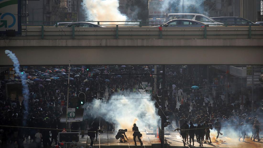 Thousands of black-clad masked protesters streamed into Hong Kong&#39;s central shopping district for another rally on November 2.