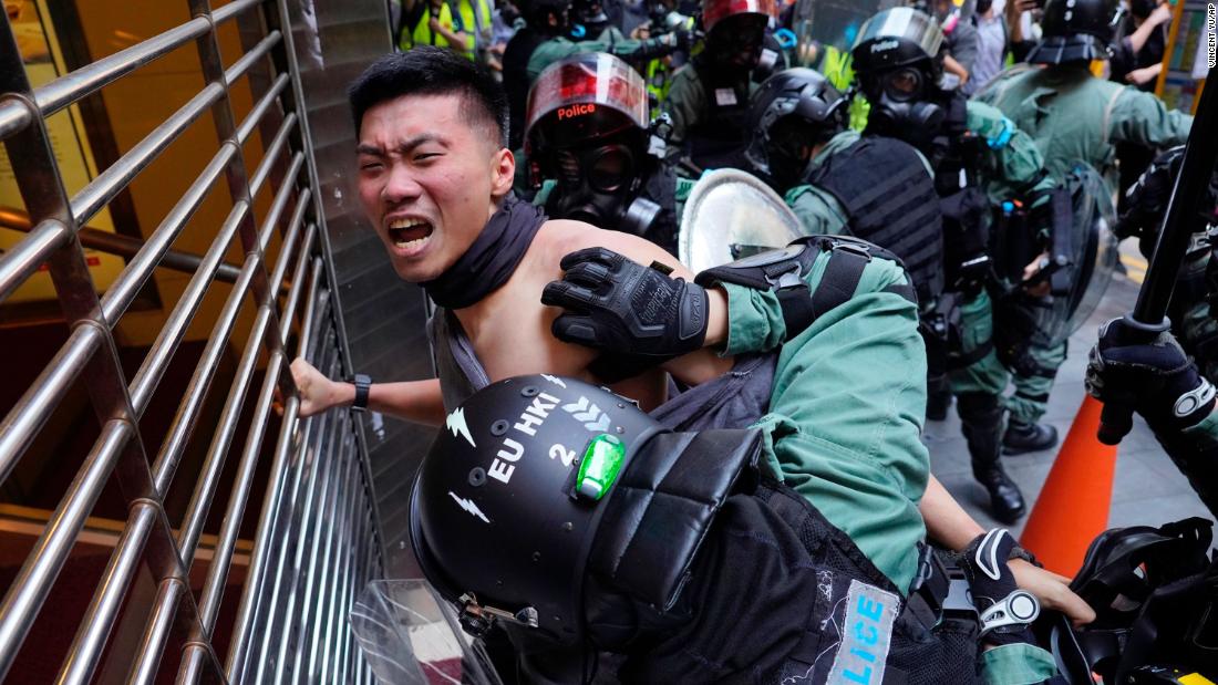 A protester is detained in the Central District of Hong Kong on November 11.