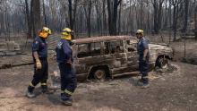 A fire and rescue team inspects damage around the village of Torrington on November 11.