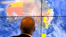 Australian Prime Minister Scott Morrison looks at a screen as he gets a briefing on the bushfire situation on November 12.