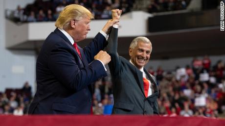 President Donald Trump stands with Louisiana Republican gubernatorial candidate Eddie Rispone during a campaign rally at the CenturyLink Center, Thursday, November 14, 2019, in Bossier City, Louisiana.
