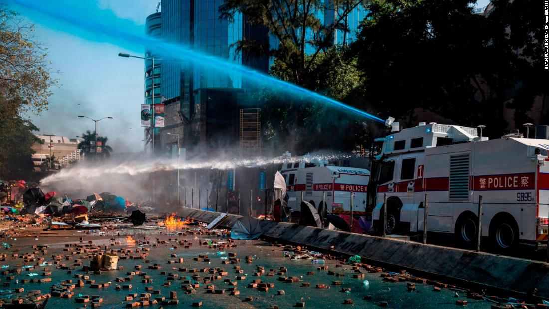 Police use a water cannon outside the Hong Kong Polytechnic University.