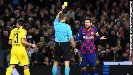 Messi receives a yellow card for diving on an historic night for the Argentine.