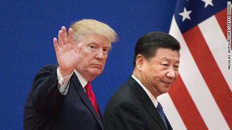 Former US President Donald Trump (left) and China&#39;s President Xi leave a business leaders event at the Great Hall of the People in Beijing in November 2017. 