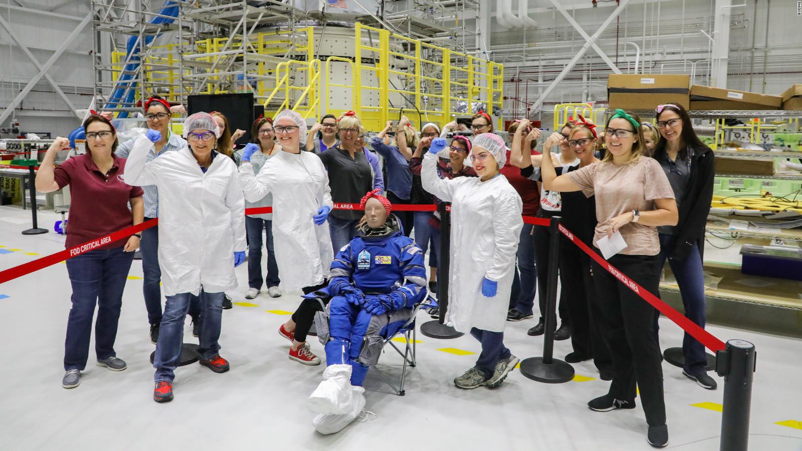 Boeing female workers surrounded Rosie the test dummy to celebrate.