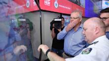 Australian Prime Minister Scott Morrison is briefed by fire officials at New South Wales Rural Fire Service control room in Sydney on December 22. Morrison arrived back in Sydney <a href="https://edition.cnn.com/2019/12/22/asia/australia-fire-prime-minister-criticism-apology/index.html" target="_blank">amid criticism after taking a family holiday to Hawaii during the bushfire emergency.</a>