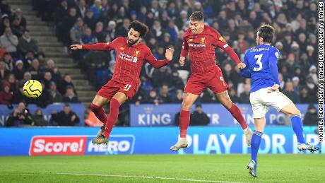 Roberto Firmino heads Liverpool in front in close company with fellow striker Mo Salah in the top of the table clash with Leiceser City at the the King Power Stadium. 