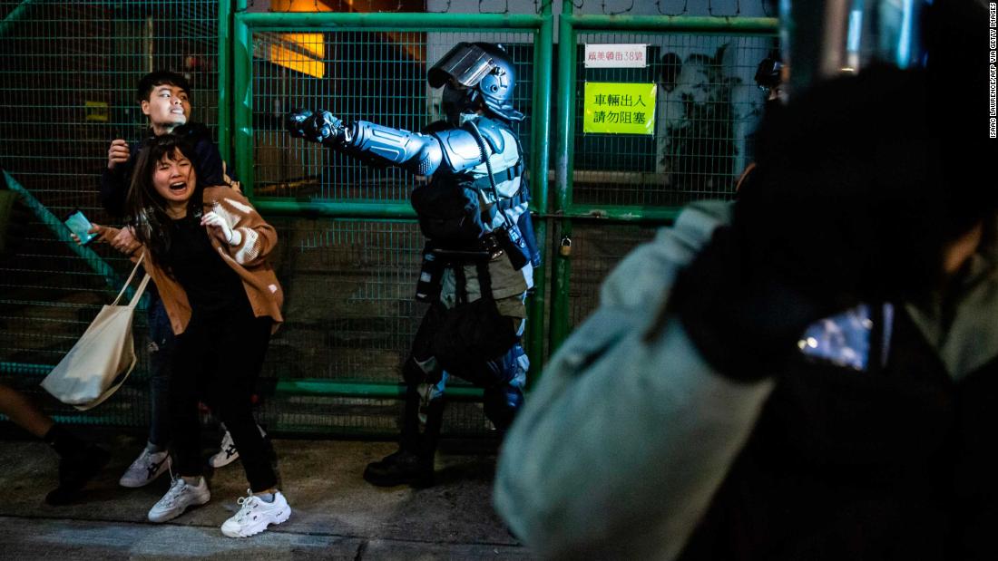 Police arrive to conduct a clearance operation in the Kowloon district of Hong Kong on December 31.