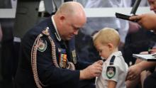 Royal Fire Service Commissioner Shane Fitzsimmons presents a posthumous Commendation for Bravery and Service on January 2 to the son of RFS volunteer Geoffrey Keaton, who was <a href="https://edition.cnn.com/2020/01/02/australia/australia-medal-firefighter-son-intl-scli/index.html" target="_blank">killed battling bushfires</a>, at Keaton's funeral in Buxton, New South Wales.