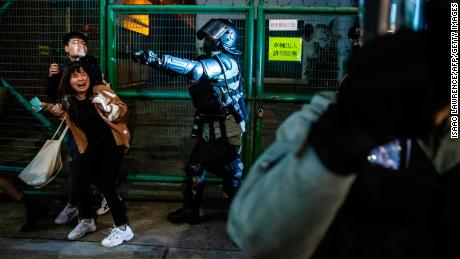 Police arrive to clear pro-democracy protesters in the Kowloon district of Hong Kong on New Year&#39;s Eve.