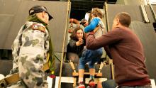 Evacuees board the Royal Australian Navy's MV Sycamore on January 3 in Mallacoota, Victoria, Australia. Navy ships plucked hundreds of people from beaches and tens of thousands were urged to flee before hot weather and strong winds in the forecast worsen Australia's already devastating wildfires.
