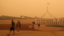 Visitors to Parliament House were forced to wear face masks after smoke from bushfires blankets Canberra in a haze on January 5.