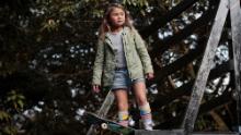 Brown stands with her skateboard before tail dropping down the half-pipe at a park in Kijo town, Miyazaki prefecture.