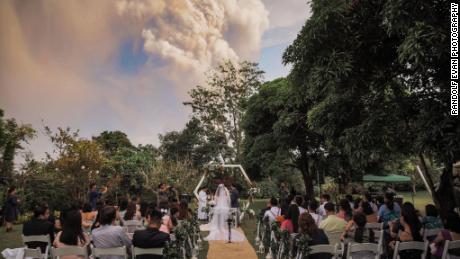 A couple got married while the Taal Volcano erupted in the background. 