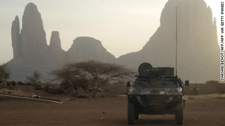 A French armoured vehicle drives by the Mount Hombori on March 27, 2019, in Mali&#39;s Gourma region as part of France&#39;s Operation Barkhane.