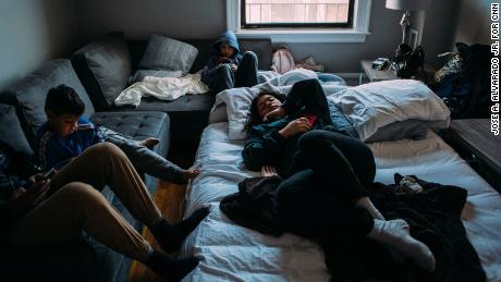 Alejandro Quiles, 16, left, his brother Alexander, 7, middle-left, their sister Ronalys, 17, on the inflatable mattress, and their cousin Sebastián Quiñones, 10, middle, lounge around on a quiet morning in New York.