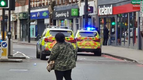 Image from the scene where a man has been shot by armed officers in Streatham. Due to the graphic nature of the scene, CNN has blurred the body of the suspect.