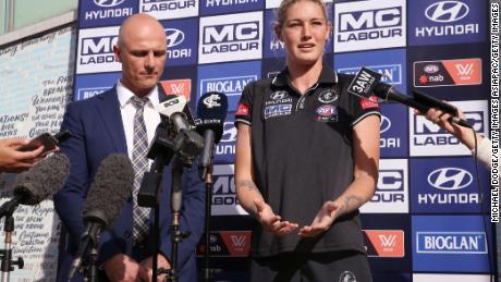 Harris speaks next to Carlton CEO Cain Liddle during a press conference at Ikon Park.