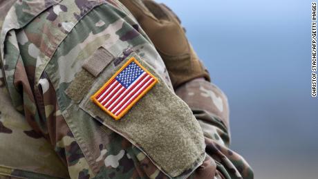 A US flag is pictured on a soldier&#39;s uniform