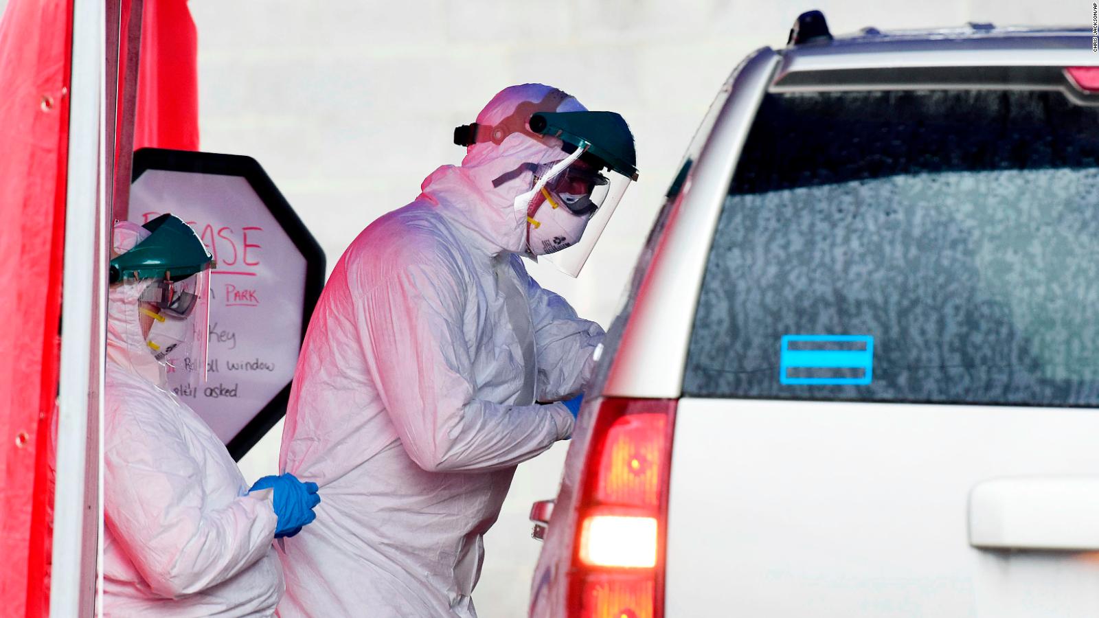 West Virginia now has drive-through sites for coronavirus testing as here, in Oak Hill, where clinical care providers take swabs from a patient.
