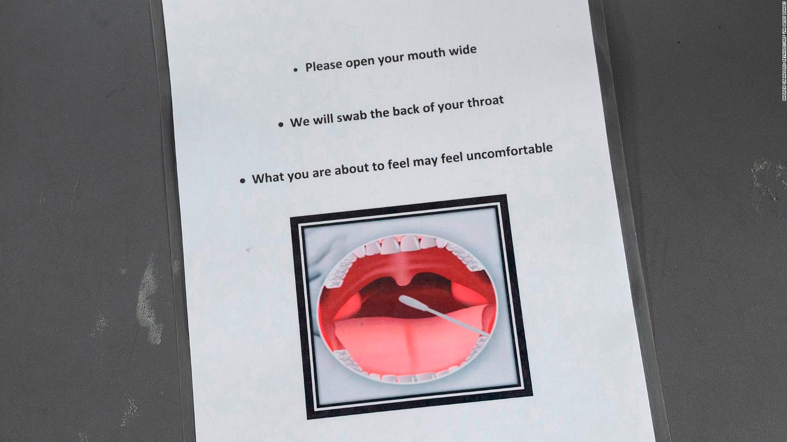 Instructions to be shown to people being tested for coronavirus are seen on a chair at a drive-through testing site in Arlington, Virginia.