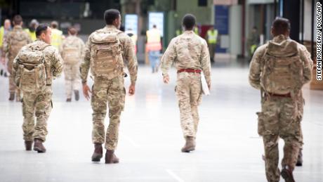 Members of the military arrive to turn the ExCel Centre in London into the NHS Nightingale Hospital. 