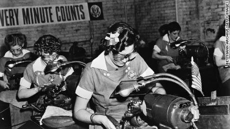 During World War II, millions of women entered the workforce for the first time. Likewise, the coronavirus pandemic is forcing millions of dads to be primary childcare providers for the first time in their working lives, economists say. (Bettmann Archive/Getty images)