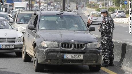 Lebanese security forces stop cars at a highway checkpoint north of Beirut on April 6, as authorities implemented further measures restricting the movement of vehicles.