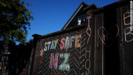 A house fence chalked up with messages relating to the Covid-19 lockdown on April 3, 2020 in Auckland, New Zealand. 