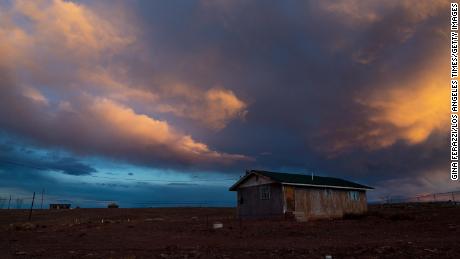 Storm clouds pass over one of many rural homes on the Navajo reservation, which do not have electricity or running water during the coronavirus pandemic in March 2020 in Cameron, Arizona. 