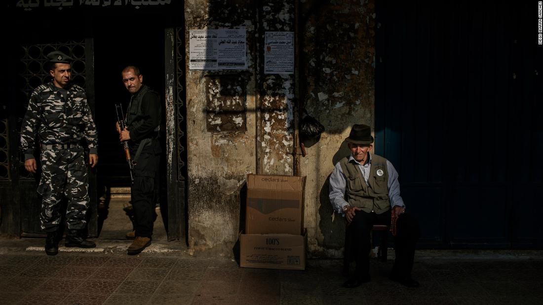 A man watches the clashes from a chair in Tripoli. &quot;There is a lot of tension in the atmosphere,&报价; Ibarra Sánchez said.