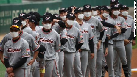 Hanwha Eagles players wear masks before the Korean Baseball Organization (KBO) League opening game between SK Wyverns and Hanwha Eagles.
