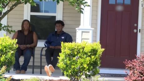 Monica and Dameon Shepard sit on their porch, where they faced questions from the group. 