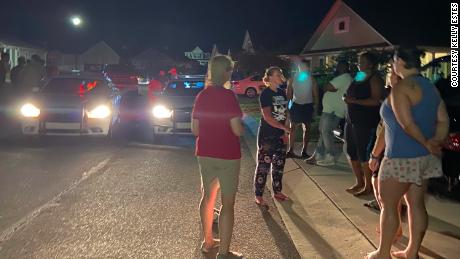 Neighbors and police gather after the group arrived at the Shepards&#39; home in Pender County on May 3.