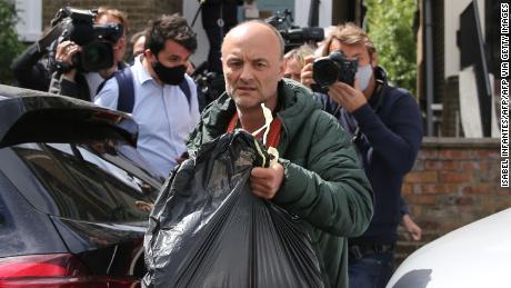 Dominic Cummings leaves his home surrounded by media in London on May 24, 2020 following allegations he broke coronavirus lockdown rules by traveling across the country in March. 