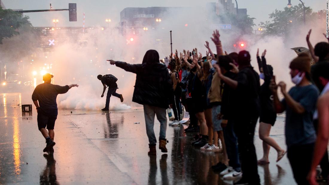 Tear gas is fired as protesters clash with police in Minneapolis on May 26.
