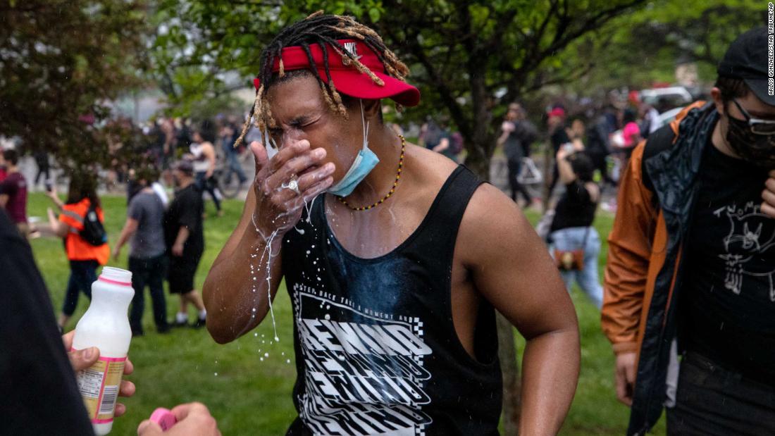 A protester is doused with milk after exposure to tear gas in Minneapolis on May 26.