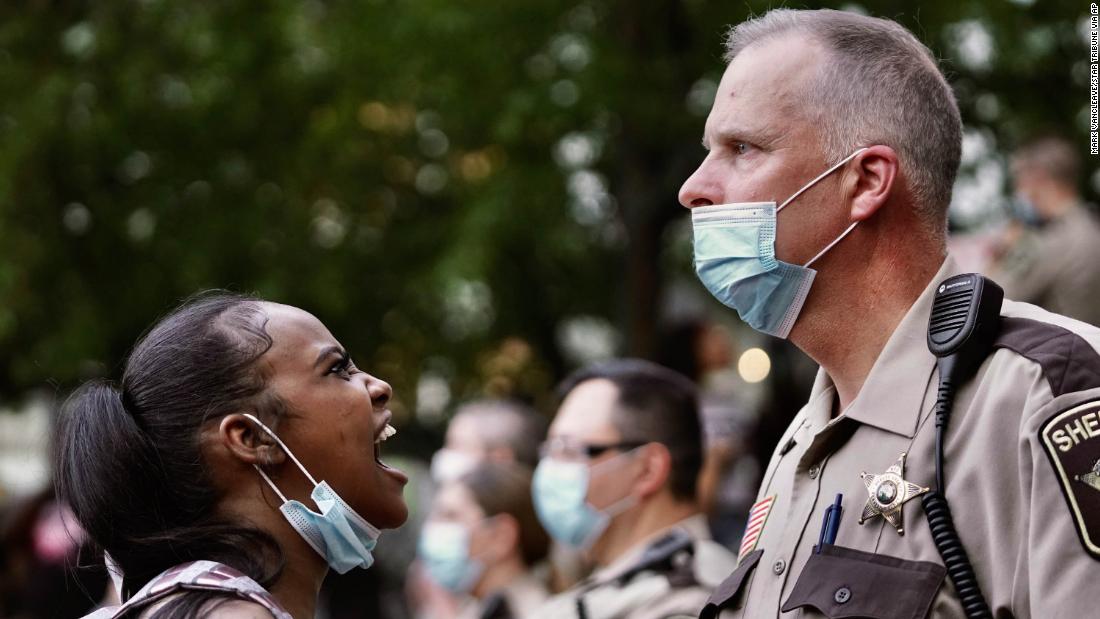 A woman yells at a sheriff&#39;s deputy during a protest in Minneapolis on May 28.