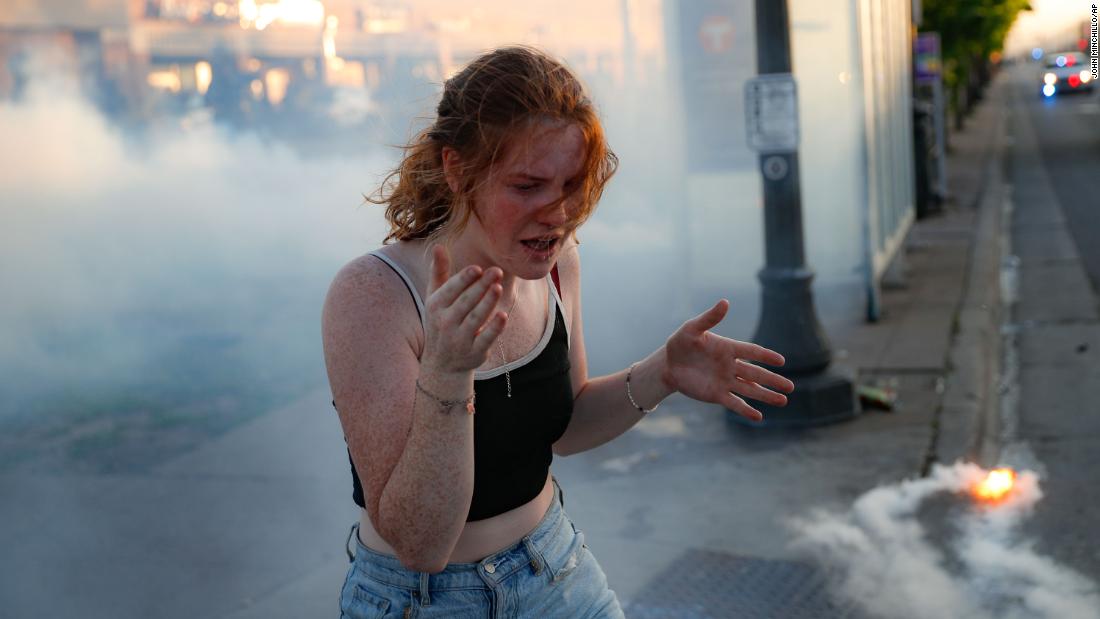 A protester reacts amid a cloud of tear gas in St. Paul on May 28.