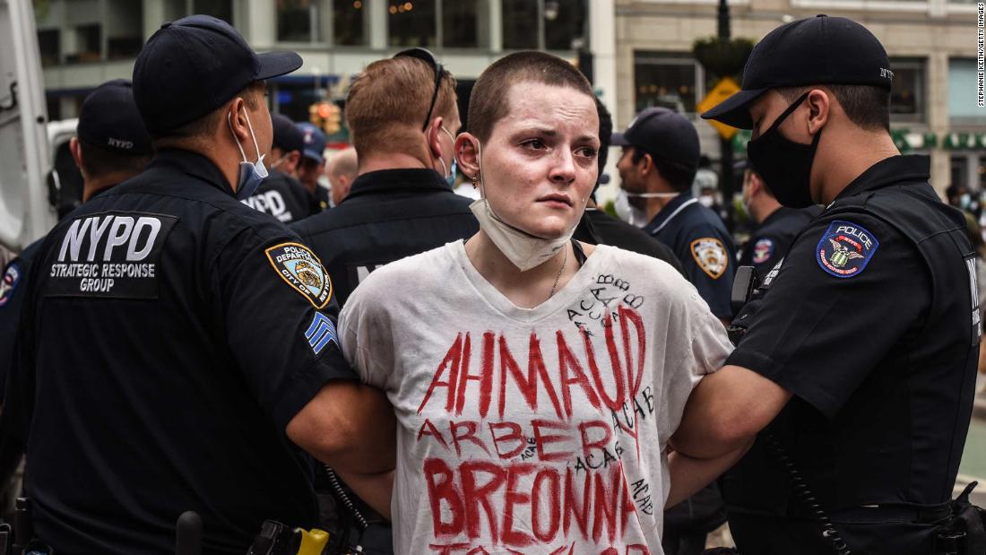 A protester is detained by police during a rally in New York City&#39;s Union Square on May 28.