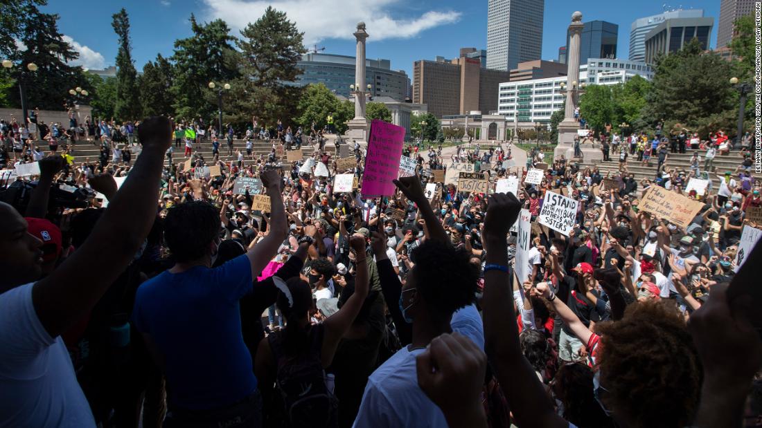 Protesters chant in Civic Center Park during a rally in Denver on May 29.