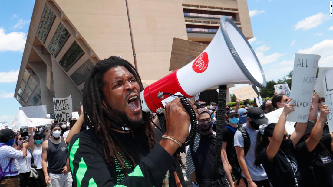 Protesters chant outside Dallas City Hall on May 30.