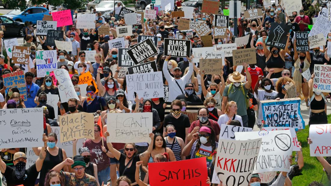 Protesters march near the Salt Lake City Police Department on May 30.