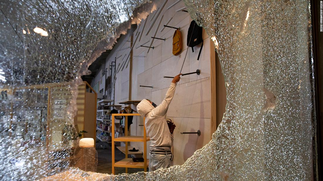 Looters ransack an Urban Outfitters store in Seattle on May 30.