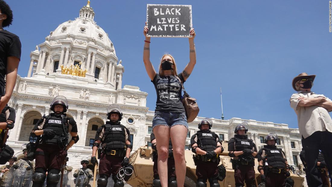 People demonstrate outside the Minnesota Capitol, which was ringed with state troopers and the National Guard on May 31.