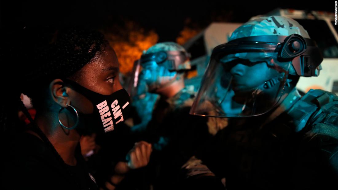 A protester faces a law enforcement officer in Washington, DC, op Junie 3.