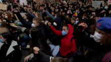 Protesters raise their fists during a Black Lives Matter rally on Tuesday in Sydney. 